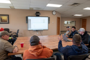 Farm managers reviewing farm data